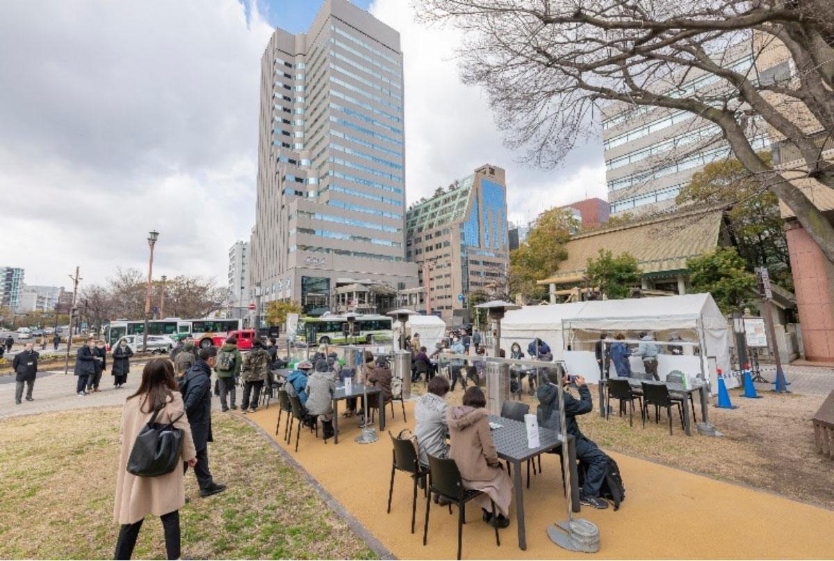 midori cafe set up in front of A-bombed survivor trees at Atago Pond